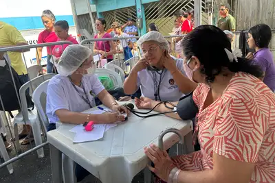 notícia: Programa "Por Todas Elas" garante atendimento médico e emissão de documentos no bairro do Tapanã, em Belém